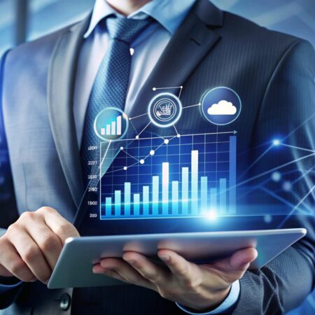 Businessman using tablet with digital graphics.